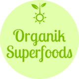 Logo for Organik Superfoods featuring green text and a sun with leaves on a light green background.